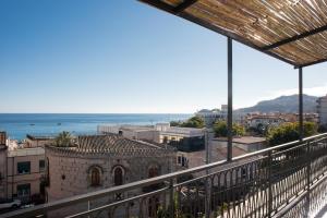 a view of the ocean from a balcony at Viewpoint Houses in Letojanni