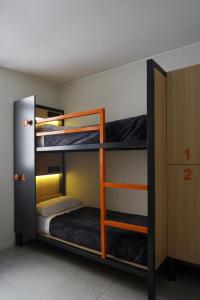a bunk bed in a small room at America Del Sur Hostel Buenos Aires in Buenos Aires