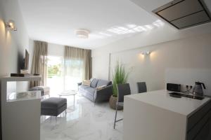 A television and/or entertainment centre at Luxury Apartments in first beach line with pool