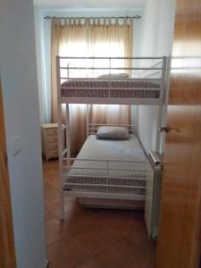 Posteľ alebo postele v izbe v ubytovaní Islantilla-Apartamento con piscina y garaje en primera línea de playa