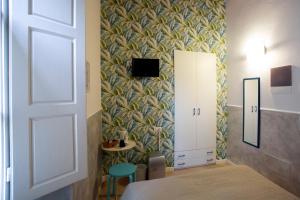 Postel nebo postele na pokoji v ubytování Hotel Bencidormi