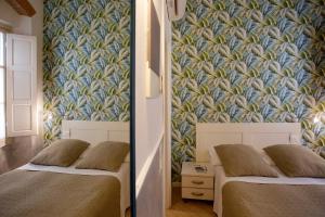 Postel nebo postele na pokoji v ubytování Hotel Bencidormi
