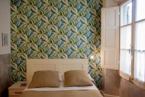 Postel nebo postele na pokoji v ubytování Hotel Bencidormi