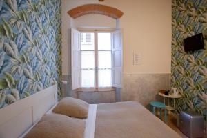 Postel nebo postele na pokoji v ubytování Hotel Bencidormi