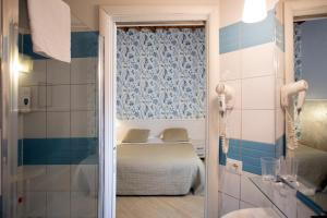 Postel nebo postele na pokoji v ubytování Hotel Bencidormi