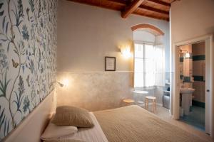 Postel nebo postele na pokoji v ubytování Hotel Bencidormi