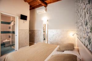 Postel nebo postele na pokoji v ubytování Hotel Bencidormi