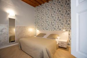 Postel nebo postele na pokoji v ubytování Hotel Bencidormi