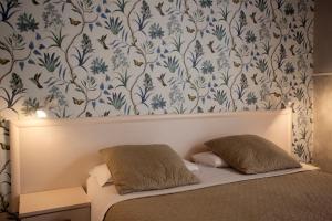 Postel nebo postele na pokoji v ubytování Hotel Bencidormi