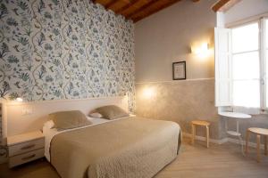 Postel nebo postele na pokoji v ubytování Hotel Bencidormi