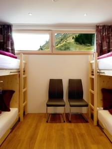 Säng eller sängar i ett rum på Wäldermetzge Hüttenzimmer und Wohnungen