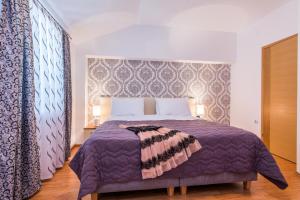 Una cama o camas en una habitación de Apartments Marina