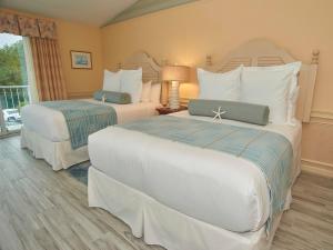 Una cama o camas en una habitación de Anchor In Hotel - Hyannis, MA