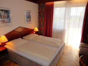 Postel nebo postele na pokoji v ubytování Komfort-Hotel Stockinger