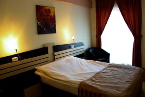 Postel nebo postele na pokoji v ubytování Hotel Zimbru