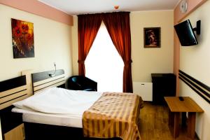 TV a/nebo společenská místnost v ubytování Hotel Zimbru