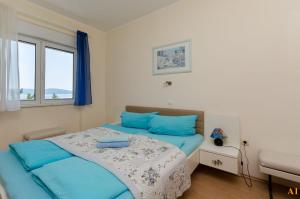 Postel nebo postele na pokoji v ubytování Apartments and Room Drazen