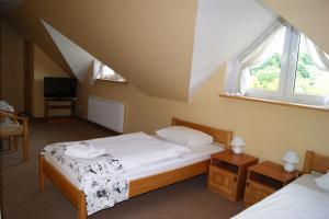Llit o llits en una habitació de Siedlisko Agroturystyczne