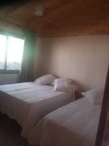 Un pat sau paturi într-o cameră la Balcón del Paraiso