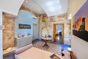 A bed or beds in a room at In Camera Art Boutique Hotel