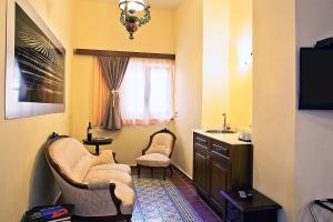 A seating area at In Camera Art Boutique Hotel