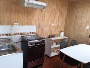 Una cocina o zona de cocina en Costanera los Molinos