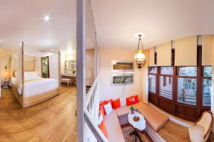 A bed or beds in a room at In Camera Art Boutique Hotel