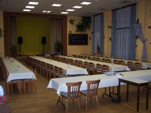 a large room with tables and chairs in it at Hotel Glindenberger Hof in Glindenberg