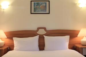 Postel nebo postele na pokoji v ubytování Efe Hotel Gocek