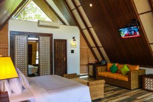 Postel nebo postele na pokoji v ubytování Liyya Water Villas