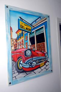 a painting of a car on the side of a building at Villa Caribe affittacamere in Monterosso al Mare