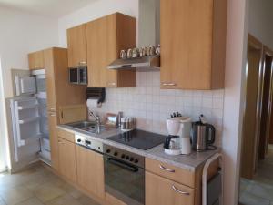 A kitchen or kitchenette at Ferienwohnungen Fritz