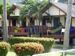 
a house that has a bunch of trees around it at Sun Beach Bungalows in Haad Rin
