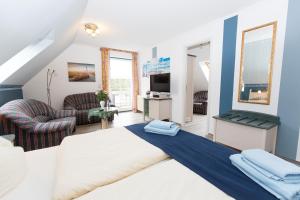 Postel nebo postele na pokoji v ubytování Hotel Garni Am Deich