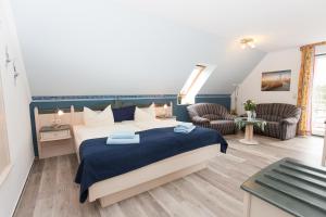 Postel nebo postele na pokoji v ubytování Hotel Garni Am Deich
