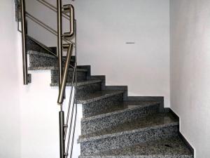 a staircase in a house with metal railings at Ferienwohnung Bäumner in Bad Berleburg