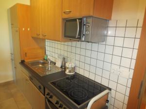 A kitchen or kitchenette at Ferienwohnungen Fritz