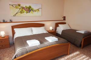 Posteľ alebo postele v izbe v ubytovaní B&B Piazza 300mila