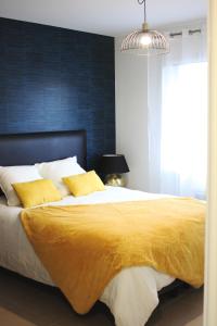 En eller flere senge i et værelse på Clos de la Couturelle