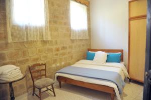 Giường trong phòng chung tại Tyre Boutique Apartments