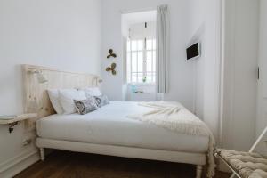 Postel nebo postele na pokoji v ubytování GuestMar