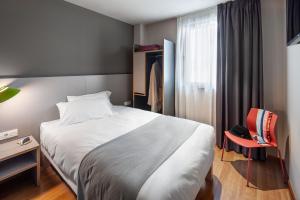 Cama o camas de una habitación en ibis Styles Pamplona Noain