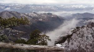 a view from the top of a mountain with clouds at Mountain house in Mala Reka