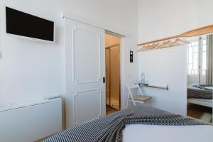 Postel nebo postele na pokoji v ubytování GuestMar