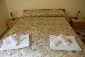 A bed or beds in a room at I Cavalieri di Malta