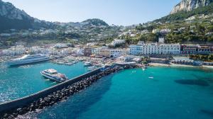 an aerial view of a harbor with boats in the water at Relais Maresca Luxury Small Hotel & Terrace Restaurant in Capri