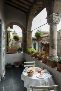 a table and chairs on an outdoor patio at Residenza Farnese in Farnese