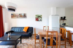 a living room with a couch and a table at Los Cristianos Edificio Verodal in Los Cristianos