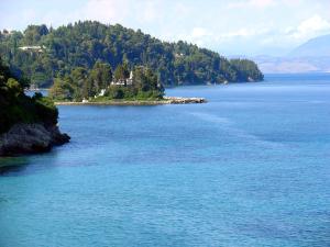 an island in the middle of a large body of water at Oasis Hotel in Perama