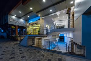 a staircase in the side of a building at Hotel Karuna Residency in Mangalore